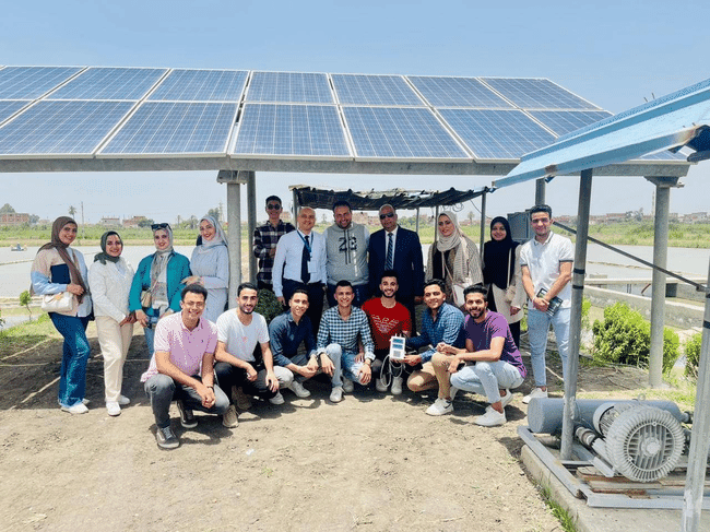 Group of people at a fish farm