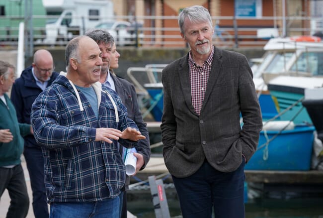 Welsh Deputy First Minister, Huw Irranca-Davies, with fishermen.