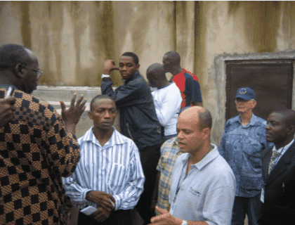 a group of men at a fish farm