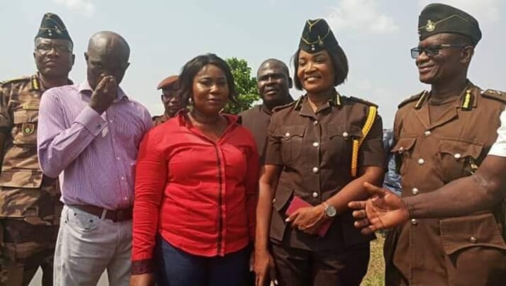 Fisheries minister Elizabeth Afoley Quaye (in red shirt) with deputy prisons minister Patience Baffoe-Bonniepresenting 1,600 tilapia fingerlings and 235 bags of fish feed to the James Camp Prison in Accra