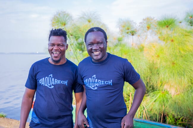 Two men smiling at camera