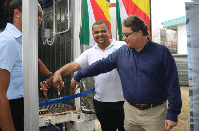 Men opening an aquaculture centre in the Seychelles.