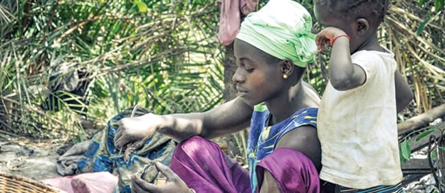 woman shucking oysters