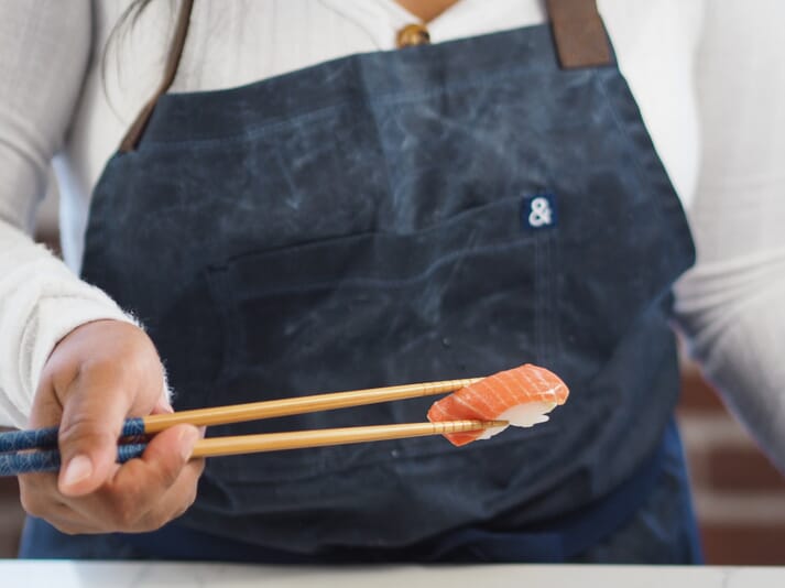 chef holding sushi