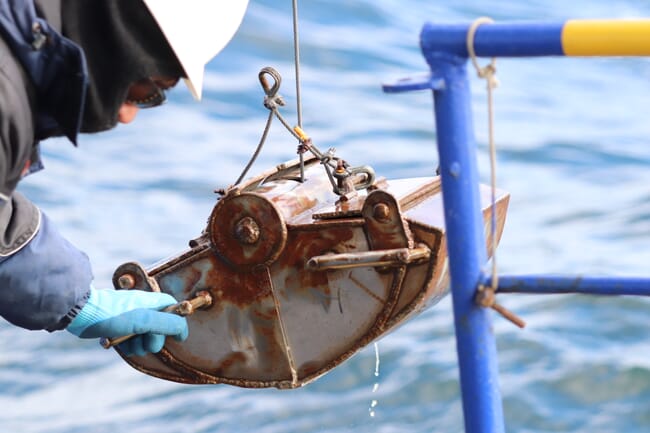 Taking a sediment sample.