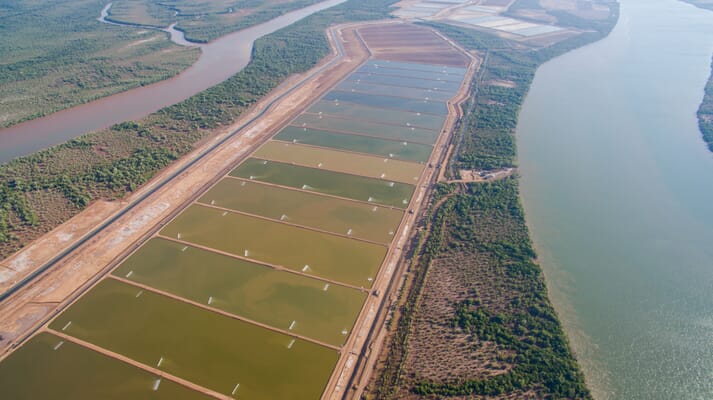 aerial view of a shrimp farm next to canals and rivers