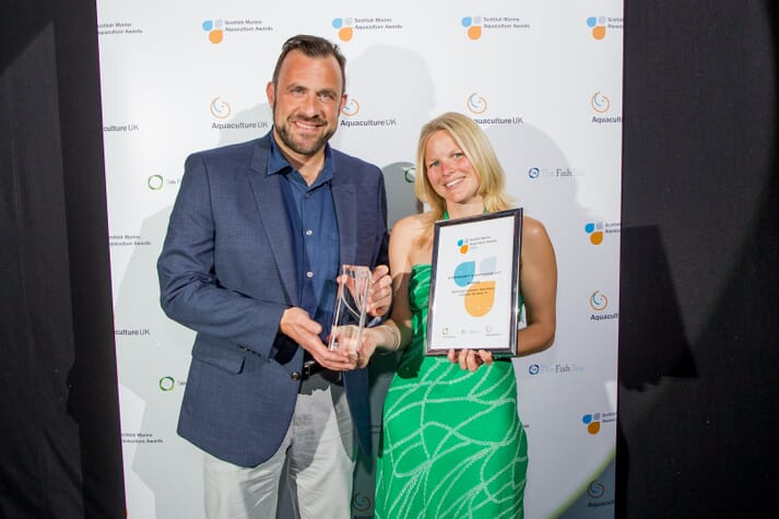 Carly Daniels, of the National Lobster Hatchery, was presented with an award by Paddy Campbell of BioMar in 2018