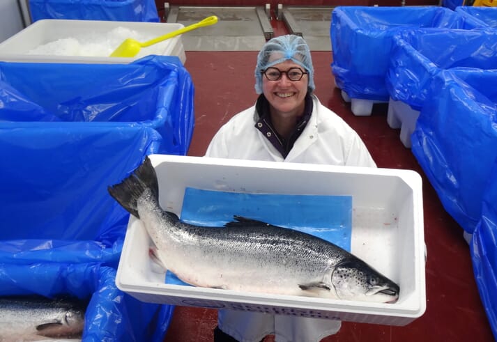 Heather Jones, CEO of SAIC, at a salmon processing facility