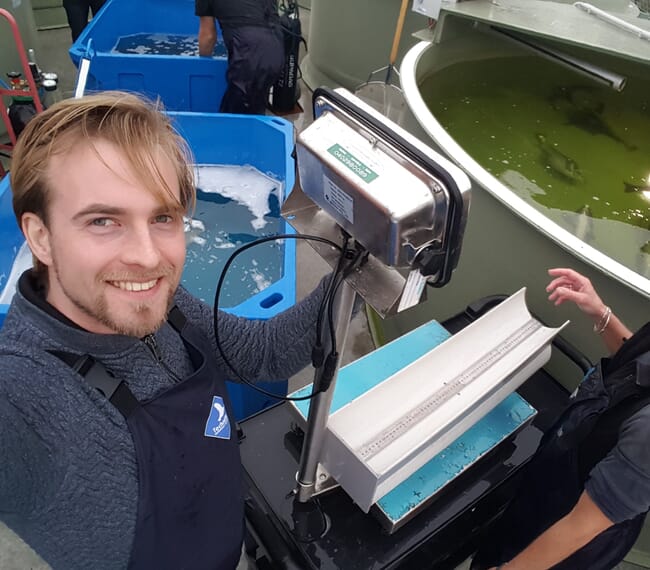 A man at a fish farm.