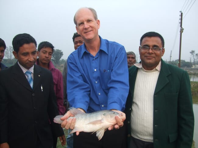 Man holding a fish.