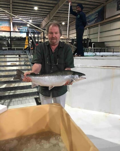 Nigel Lewis holding an Atlantic salmon