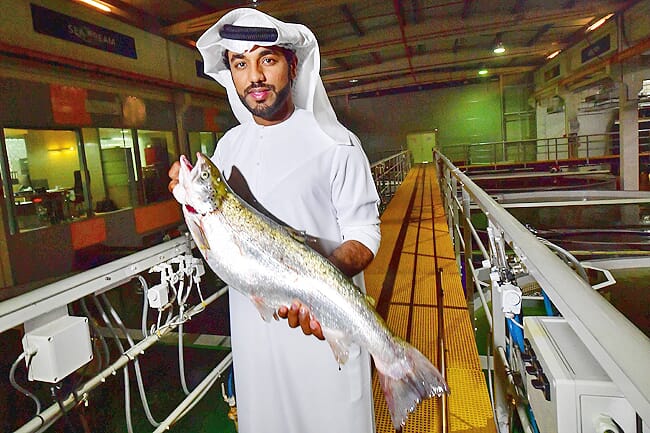Bader bin Mubarak holding a salmon