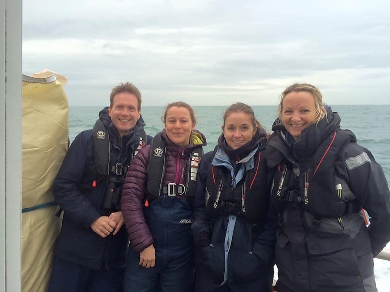 four people on a boat