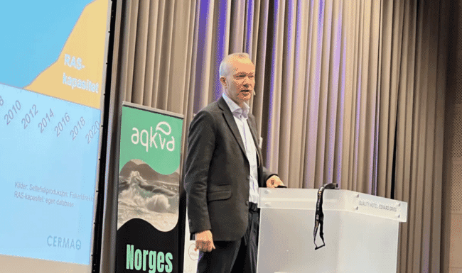 a man delivering a talk from a lectern