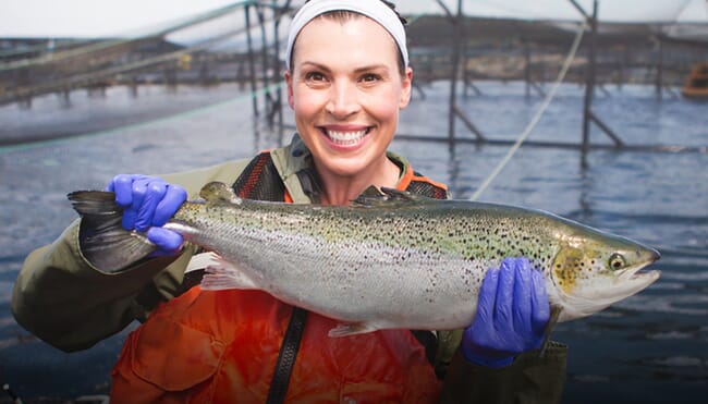 woman holding a fish