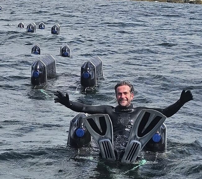 Tom Ashton tending oyster cages.