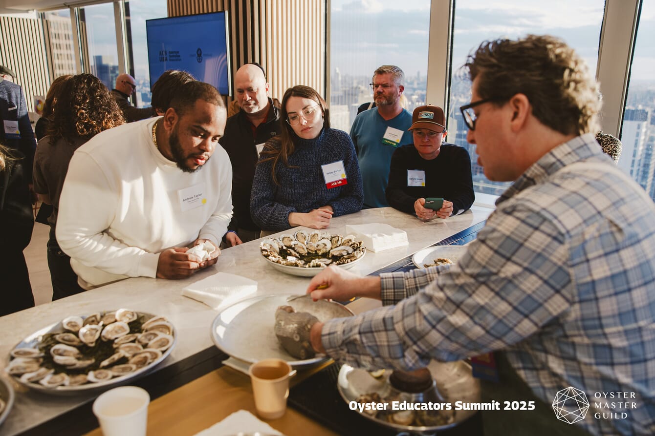 A man speaking to an oyster enthusiast.