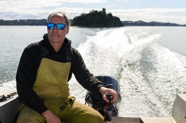 a man steering a boat