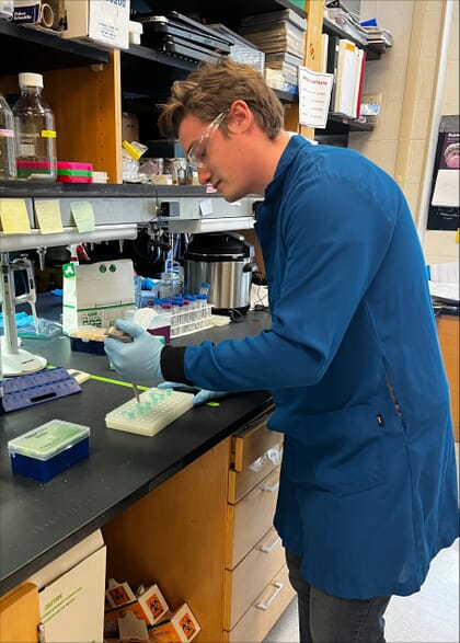 James Sibley in a lab coat