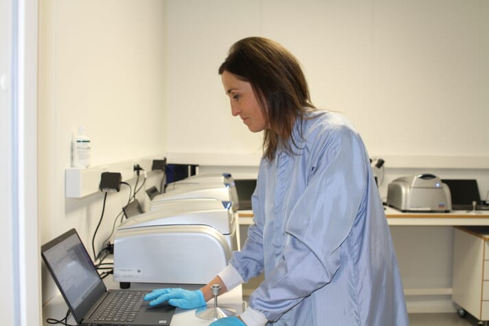 researcher using a PCR machine