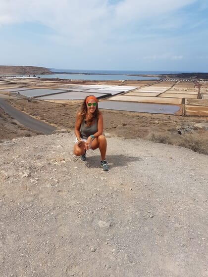 Woman smiling with salterns in the distance