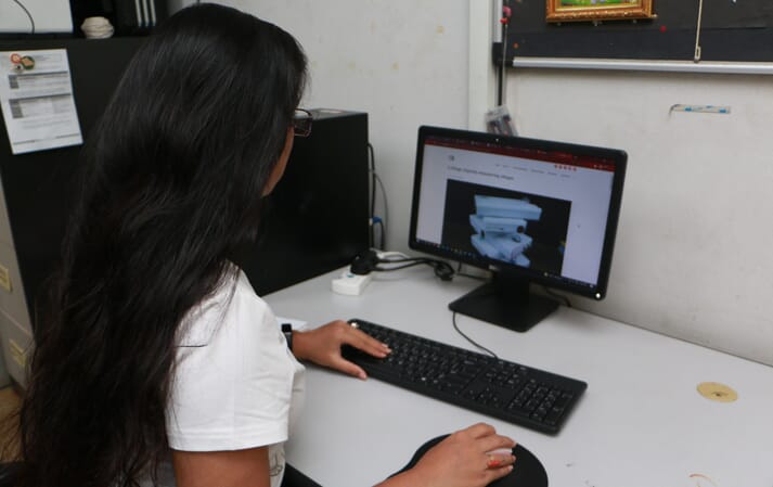 woman sitting at a computer
