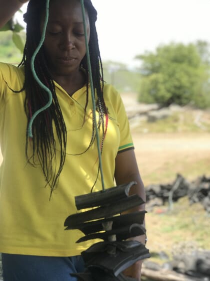 Woman holding an oyster string