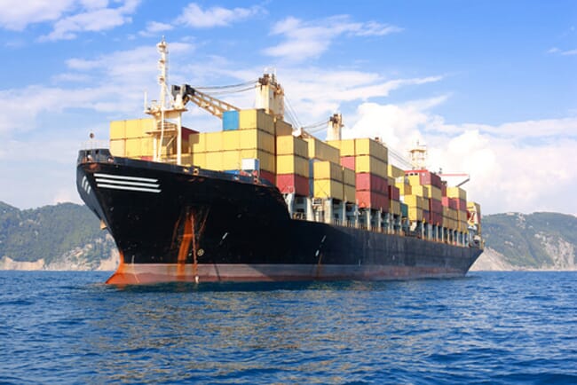 A close up of a cargo boat transporting containers.